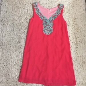 Coral sundress with turquoise lace trim